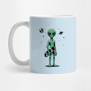 Alien carrying a skateboard Mug